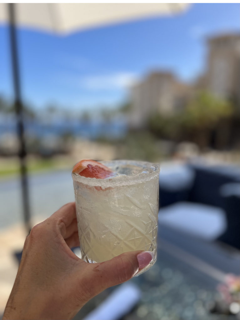 Kristi at the beach holding a glass of margarita

The Kristi Jones Podcast - My Version of a "Healthy" Margarita