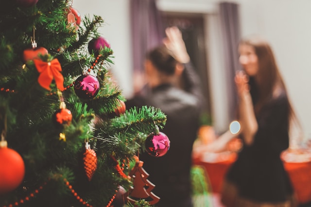 Decorated Christmas tree with a blurry image of happy people in the background 
The Kristi Jones Podcast - Unwrapping freedom: Navigating Empty Nest Holidays