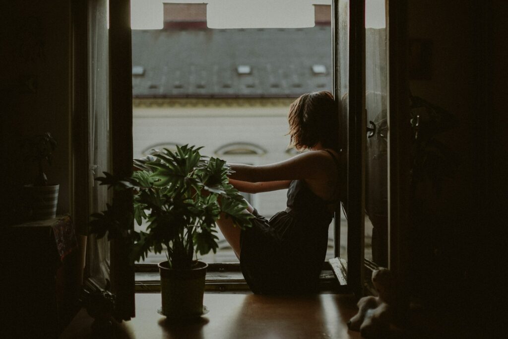 Woman standing by window, gazing thoughtfully outside

The Kristi Jones Podcast: Reframing Thoughts when things get tough